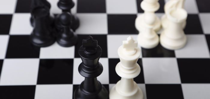 acquisitions and exits chess board and pieces